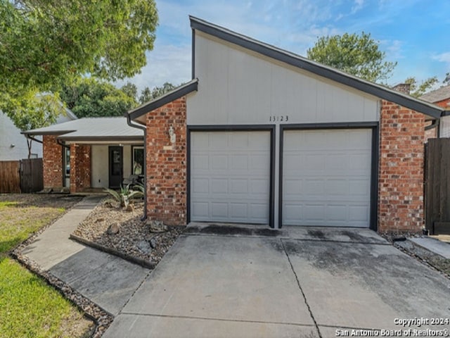 single story home featuring a garage