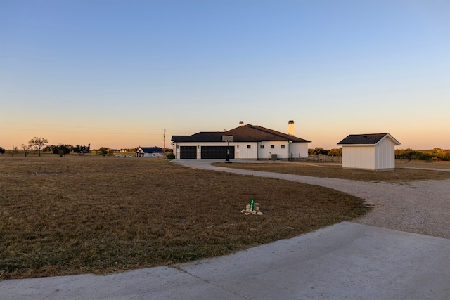 ranch-style home featuring a storage shed