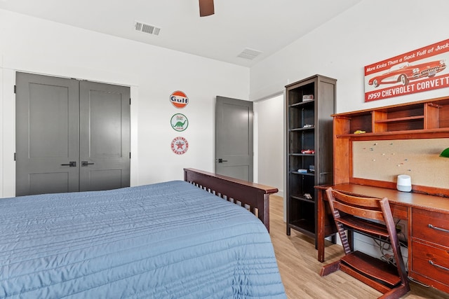 bedroom featuring ceiling fan, a closet, and light hardwood / wood-style floors