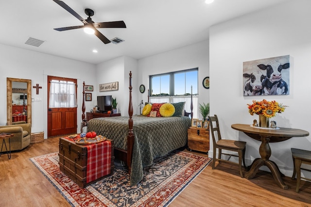345 Judges Rd, Burnet, TX 78611 - bedroom with multiple windows, light wood-style flooring, recessed lighting, and a ceiling fan