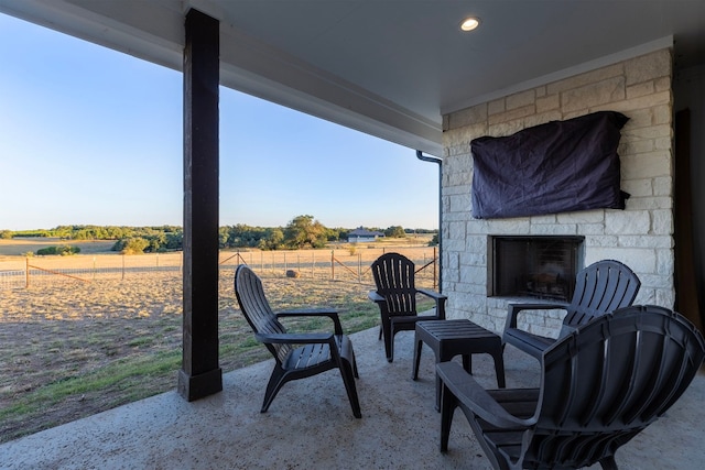 345 Judges Rd, Burnet, TX 78611 - view of patio with an outdoor stone fireplace and a view of countryside
