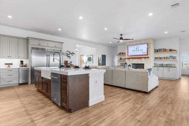 345 Judges Rd, Burnet, TX 78611 - kitchen featuring appliances with stainless steel finishes, a ceiling fan, light countertops, light wood finished floors, and recessed lighting