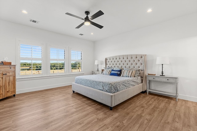 bedroom featuring wood-type flooring and ceiling fan