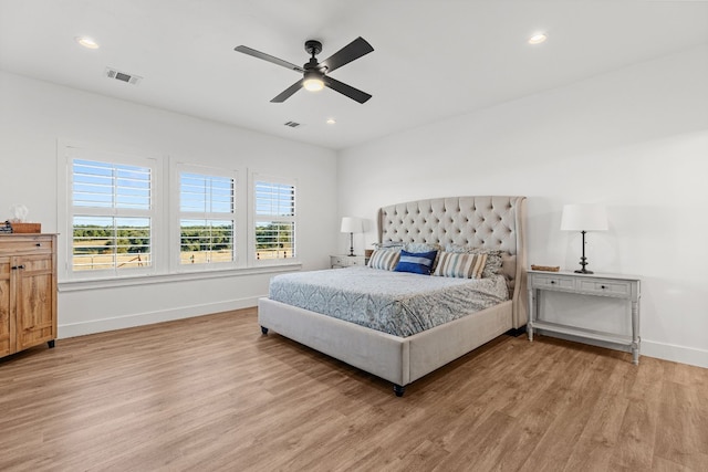 345 Judges Rd, Burnet, TX 78611 - bedroom with light wood-style flooring, ceiling fan, and recessed lighting