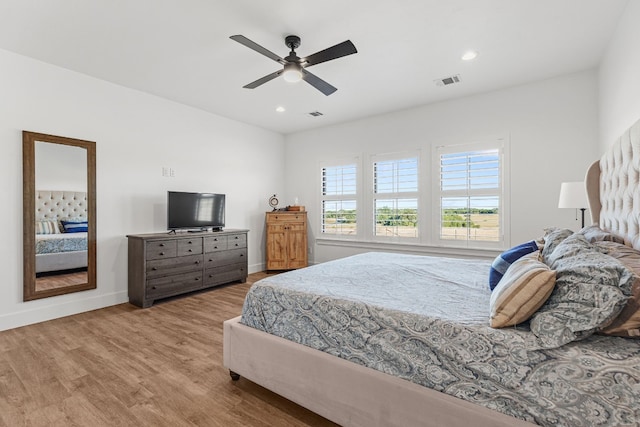 bedroom featuring light hardwood / wood-style flooring and ceiling fan