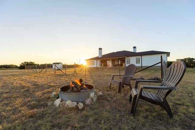 345 Judges Rd, Burnet, TX 78611 - back of property with a fire pit and a yard