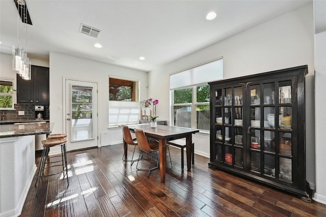 dining area featuring dark hardwood / wood-style flooring