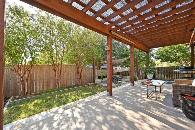 view of patio / terrace featuring a grill and a pergola