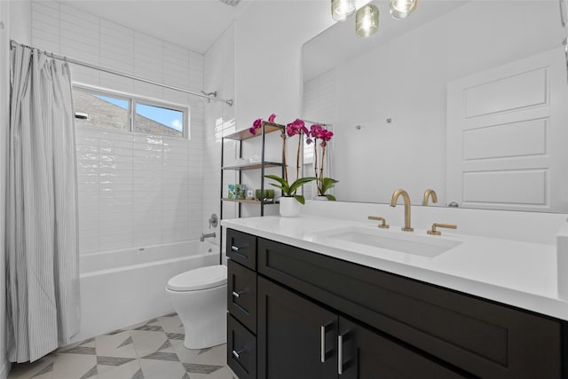 full bath featuring vanity, shower / bath combo with shower curtain, and toilet