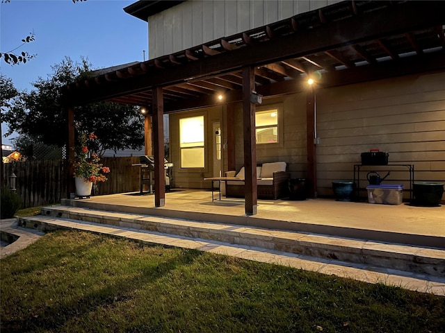 view of patio featuring fence