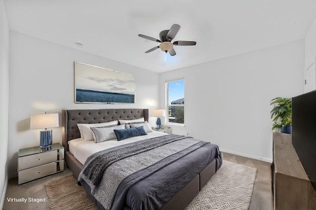 carpeted bedroom with ceiling fan