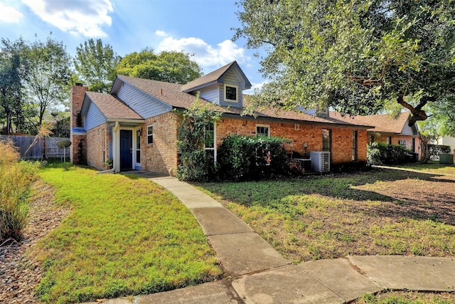 view of front facade with a front lawn and central AC unit