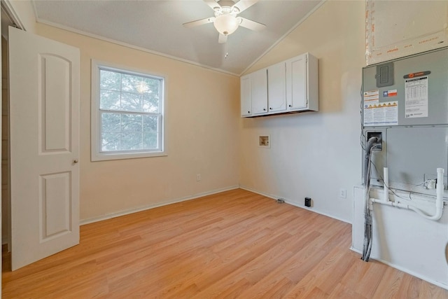 laundry area featuring cabinets, hookup for a washing machine, light hardwood / wood-style flooring, ceiling fan, and ornamental molding