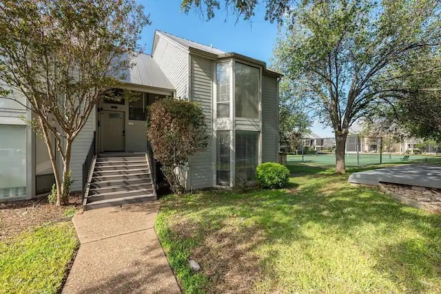 view of front of property with a front lawn