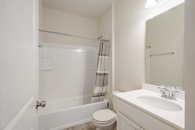 full bathroom with vanity, hardwood / wood-style flooring, toilet, and shower / tub combo with curtain