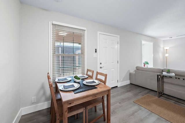 dining space featuring hardwood / wood-style floors