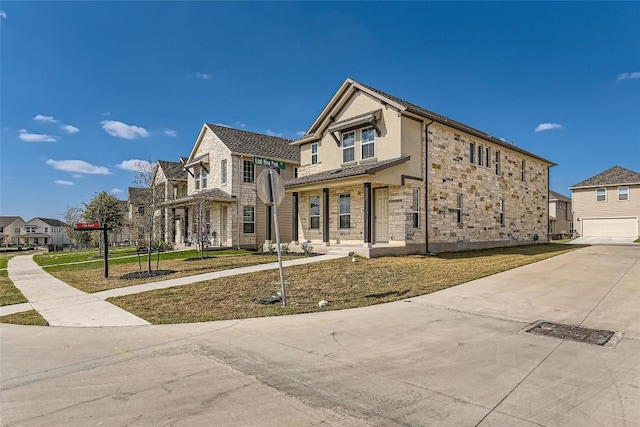 196 Lost Mine Peak Ln, Dripping Springs, TX 78620 - view of front of home with stone siding, stucco siding, and driveway