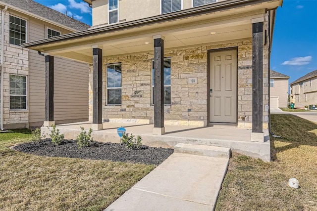 196 Lost Mine Peak Ln, Dripping Springs, TX 78620 - entrance to property with a porch and stone siding