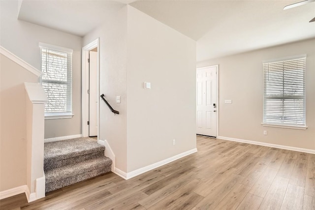 196 Lost Mine Peak Ln, Dripping Springs, TX 78620 - stairs featuring wood finished floors and baseboards