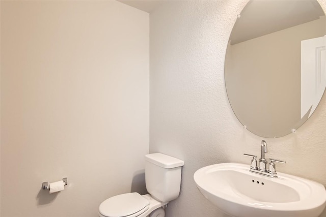 196 Lost Mine Peak Ln, Dripping Springs, TX 78620 - half bathroom with a sink and toilet