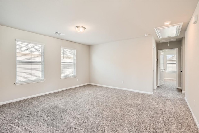 196 Lost Mine Peak Ln, Dripping Springs, TX 78620 - spare room featuring attic access, light colored carpet, healthy amount of natural light, and baseboards
