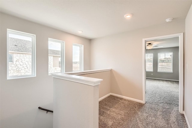 196 Lost Mine Peak Ln, Dripping Springs, TX 78620 - hallway with an upstairs landing, carpet flooring, and baseboards