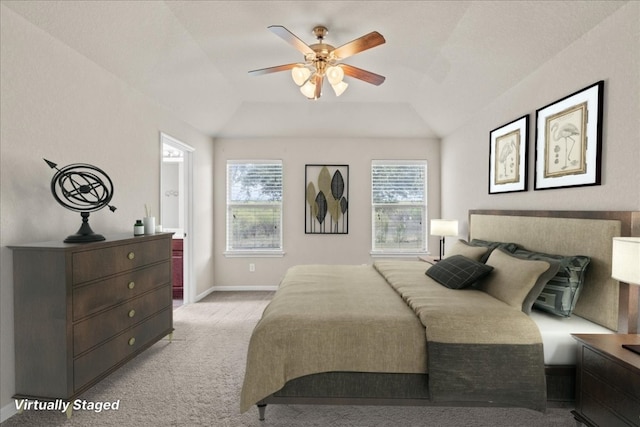 carpeted bedroom featuring ceiling fan, lofted ceiling, and multiple windows