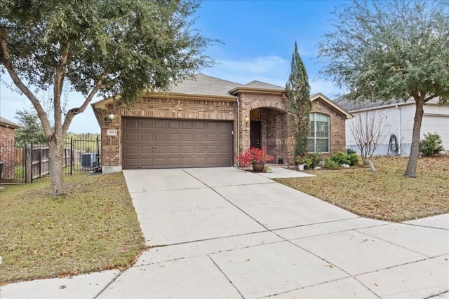 single story home featuring a front lawn, a garage, and central AC