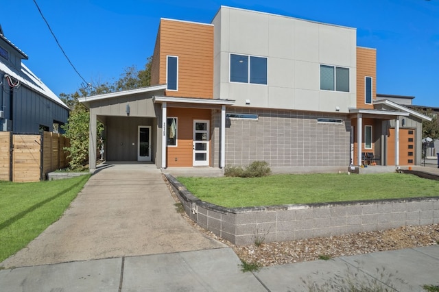 contemporary house featuring a front lawn