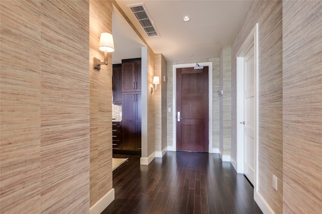 hallway featuring dark hardwood / wood-style flooring