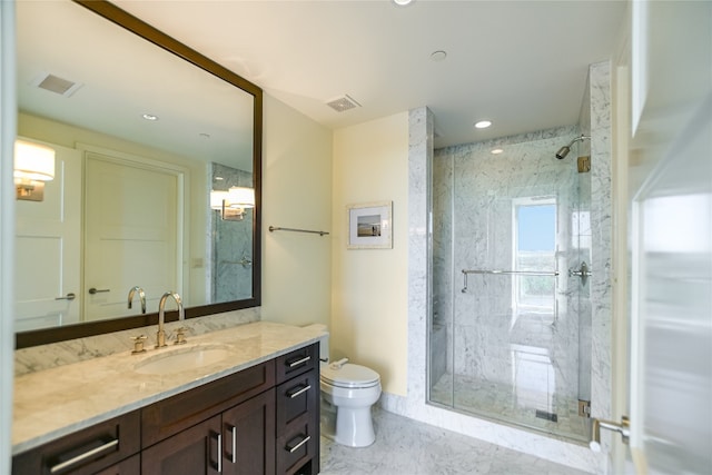 bathroom with vanity, toilet, and walk in shower