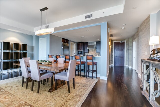 dining room with dark hardwood / wood-style floors