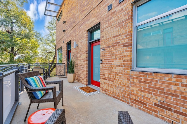 view of patio featuring a balcony