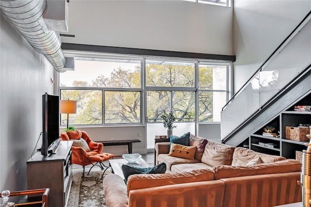 living room with a towering ceiling