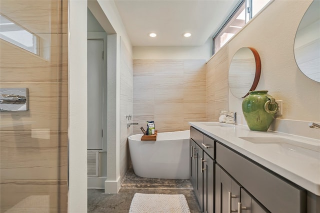 bathroom with vanity and a bathing tub