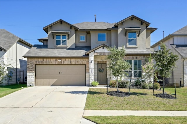 view of front of house with a garage and a front yard