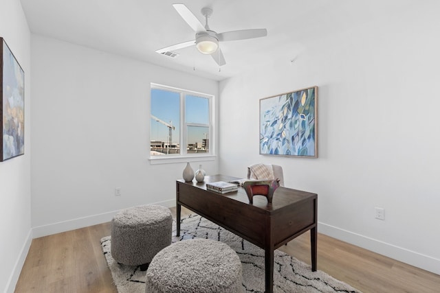 office area featuring light hardwood / wood-style floors and ceiling fan