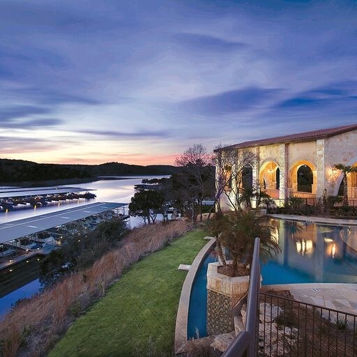 pool at dusk with a water view