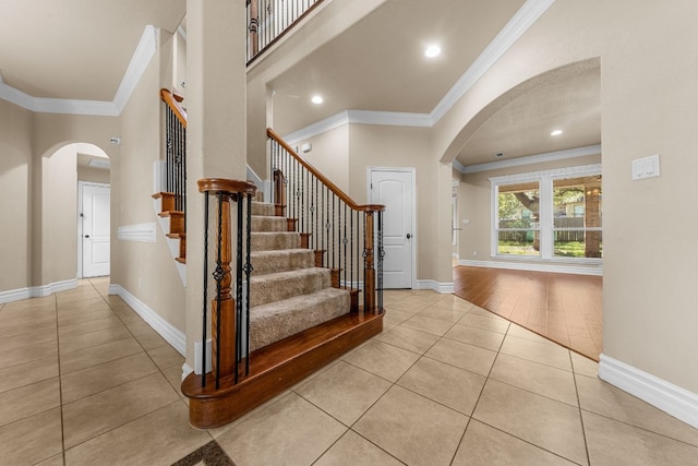 entryway featuring light hardwood / wood-style flooring and ornamental molding