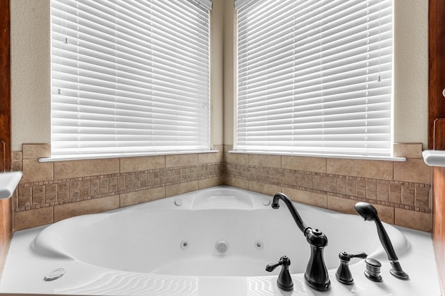 bathroom featuring a tub to relax in