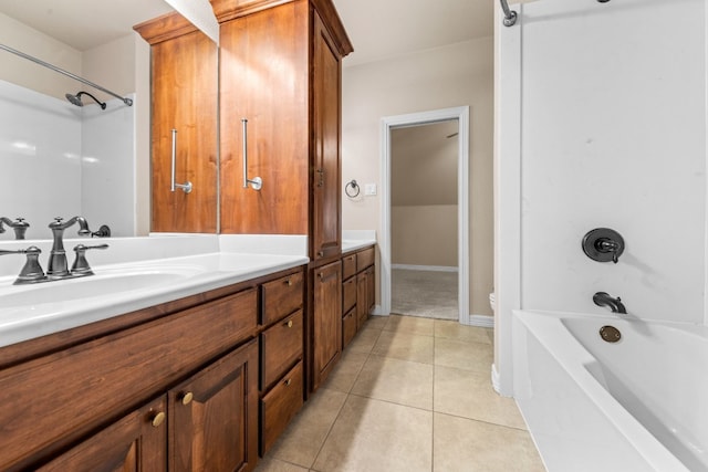 bathroom with vanity, bathing tub / shower combination, and tile patterned flooring