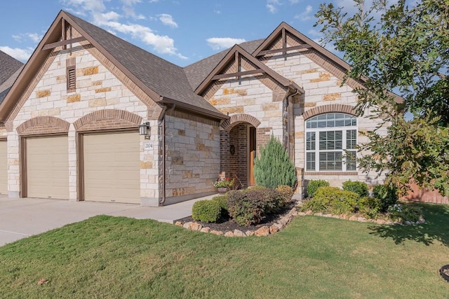 2104 Highland Ridge Rd, Georgetown, TX 78628 - french country style house featuring stone siding, an attached garage, driveway, a front lawn, and a shingled roof