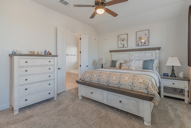 carpeted bedroom featuring connected bathroom and ceiling fan