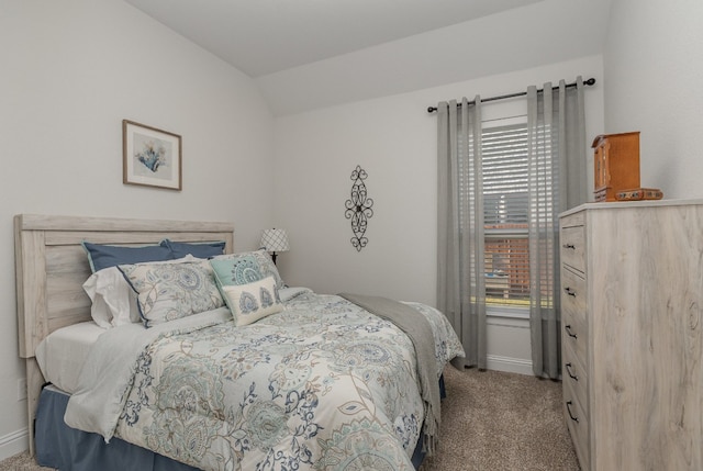 carpeted bedroom featuring vaulted ceiling