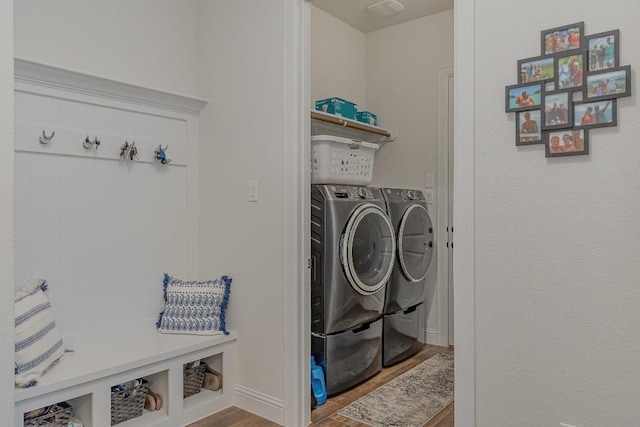 2104 Highland Ridge Rd, Georgetown, TX 78628 - laundry room with washing machine and dryer and wood finished floors