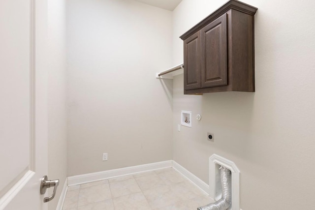 laundry room with washer hookup, electric dryer hookup, gas dryer hookup, and cabinets