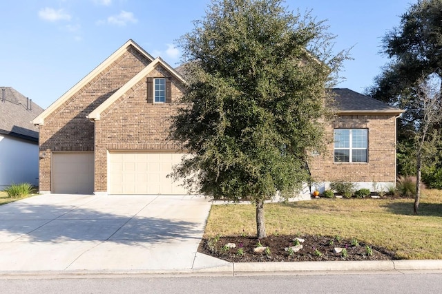 view of front of home featuring a garage and a front yard