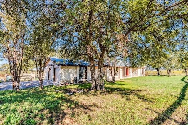 view of front of property with a garage and a front yard