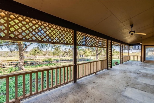 view of patio / terrace featuring ceiling fan and a rural view