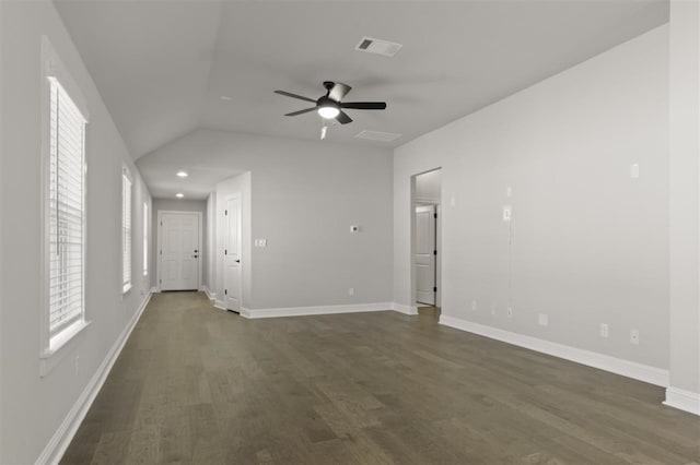 empty room featuring lofted ceiling, ceiling fan, and dark hardwood / wood-style floors